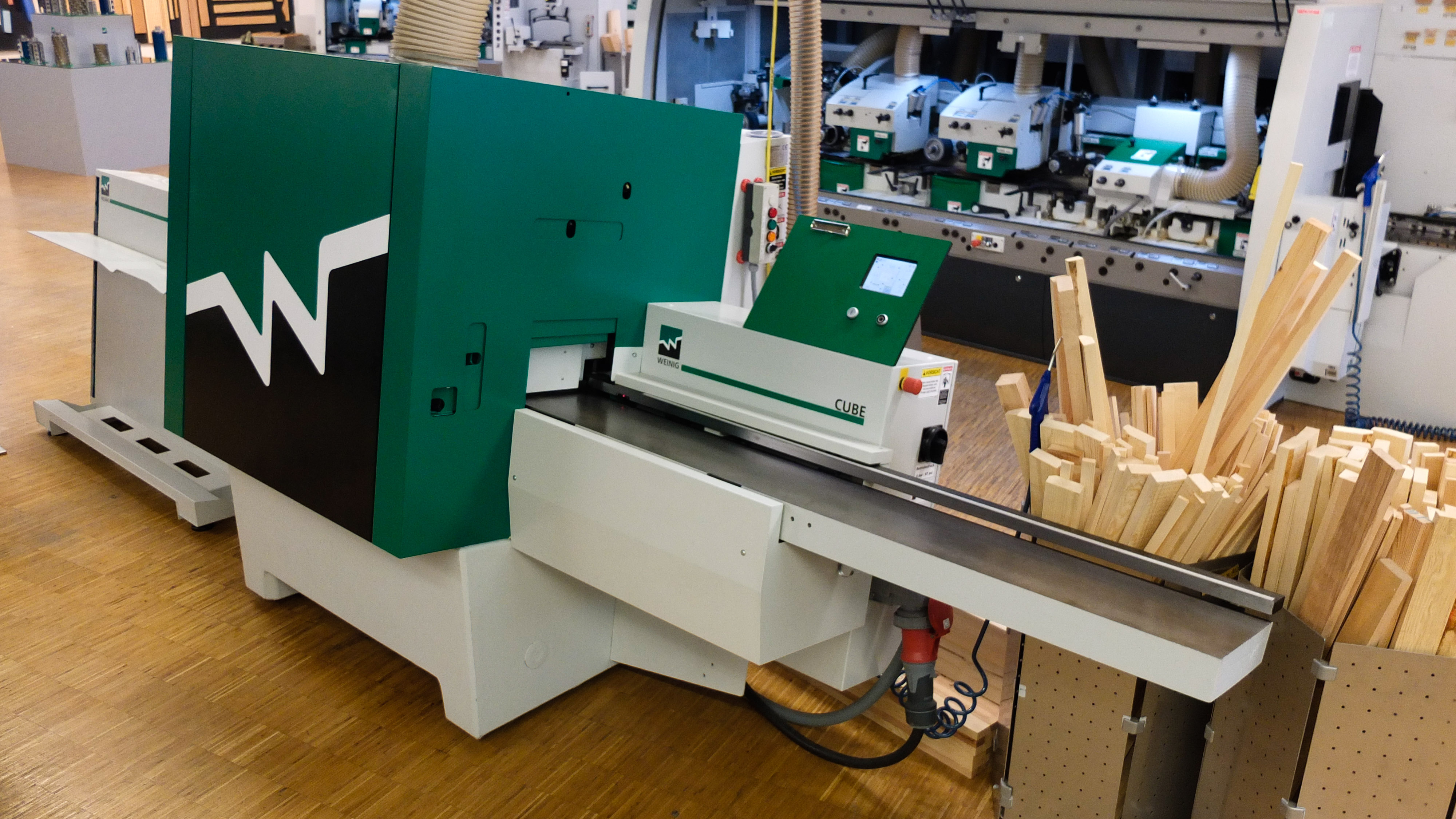 Weinig Cube Vierseitenhobelmaschine für die industrielle Holzverarbeitung mit Vorschubsystem und Schneidkopfanordnung